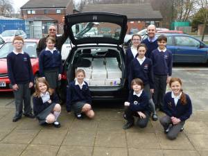 Rotarian Nick Philpott with pupils and staff of Norwood School